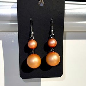 Peach pearl dangle earrings